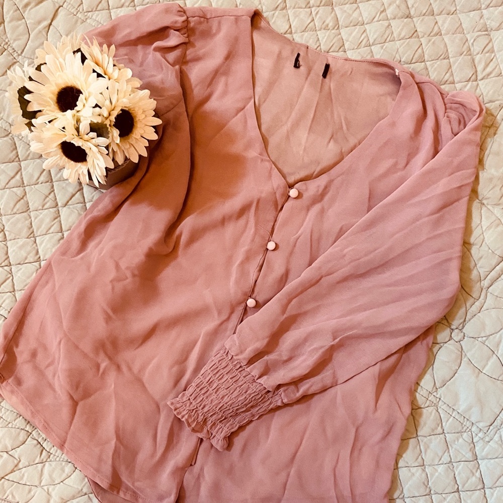 Pink top. Sheer sleeves